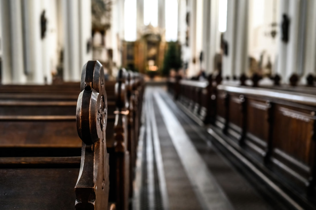The seats of a church empty and lined up, ready to receive people for Easter after checking that the kitchen still meets hygiene regulations.