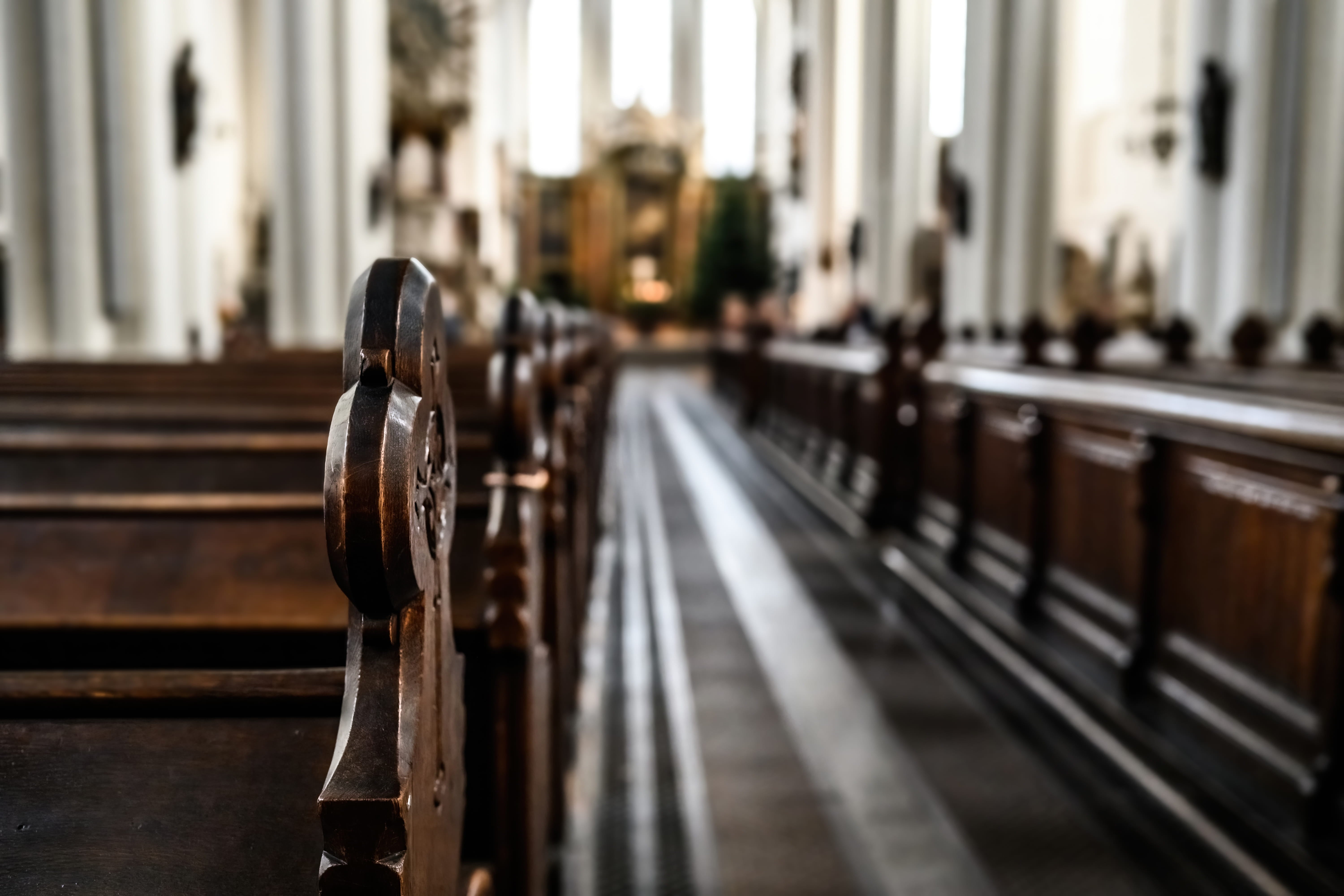The seats of a church empty and lined up, ready to receive people for Easter after checking that the kitchen still meets hygiene regulations.