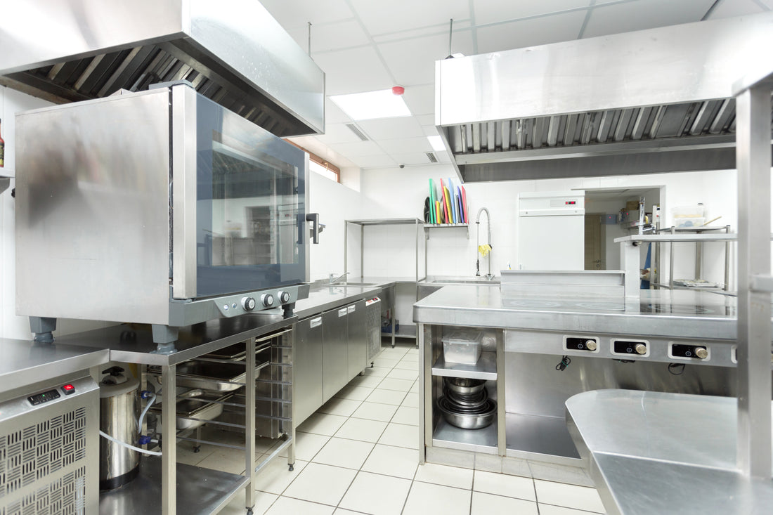 Commercial kitchen workspace with cooking equipment, representing budget kitchen equipment and long-term cost considerations.