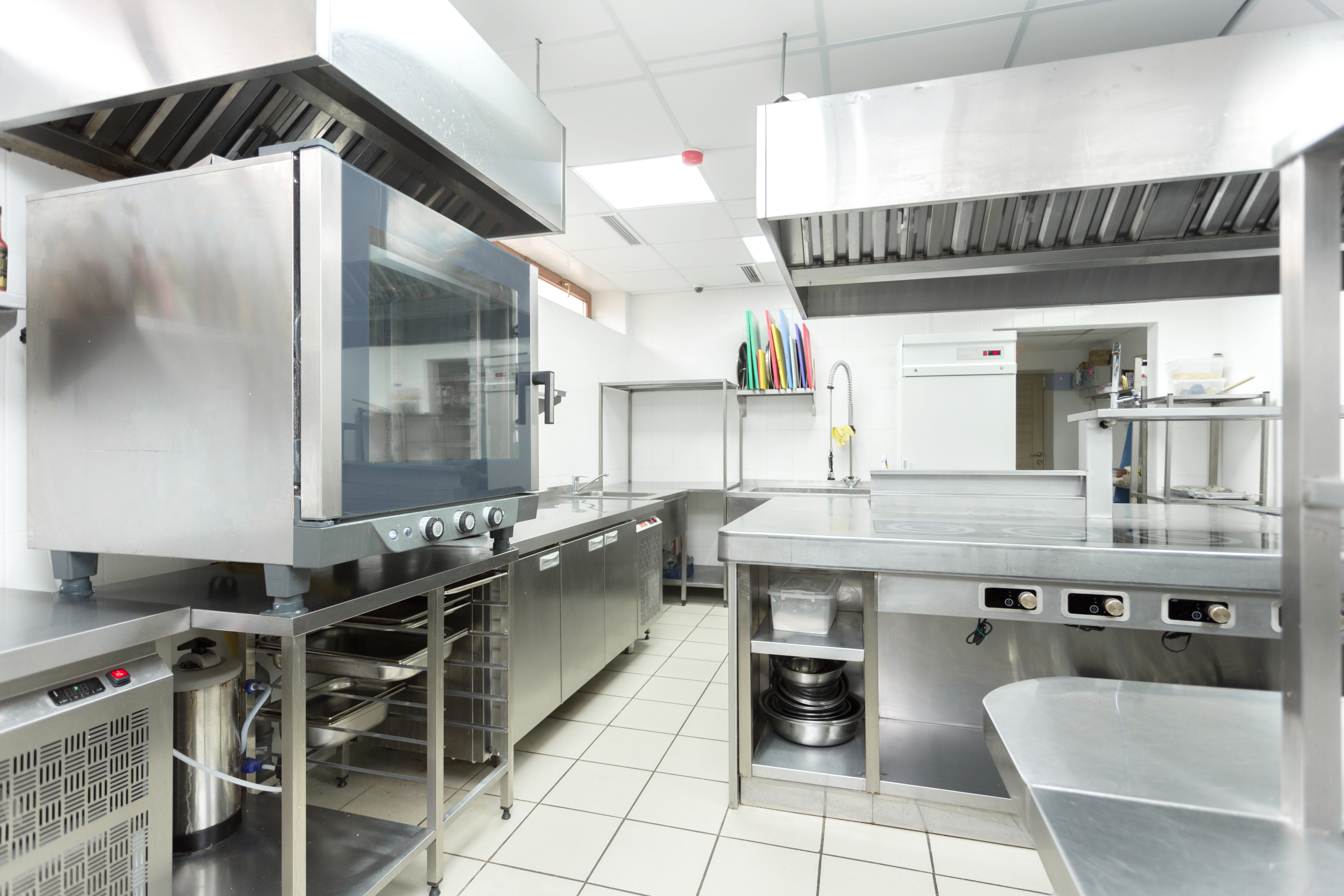 Commercial kitchen workspace with cooking equipment, representing budget kitchen equipment and long-term cost considerations.