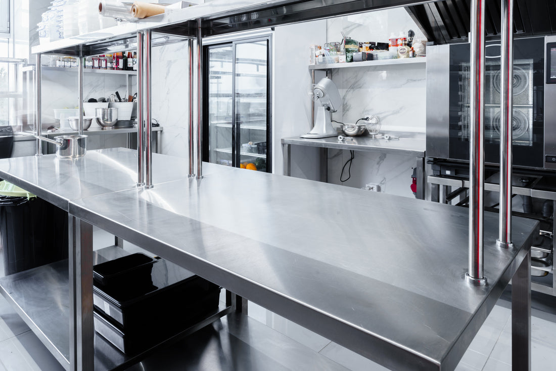 Bespoke stainless steel workbench showcasing steel table fabrication for a professional commercial kitchen.
