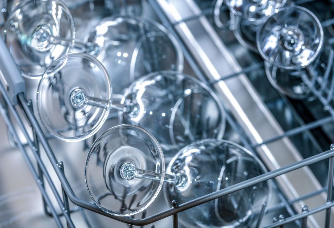 A commercial dishwasher used in a restaurant in the UK to clean wine glasses.
