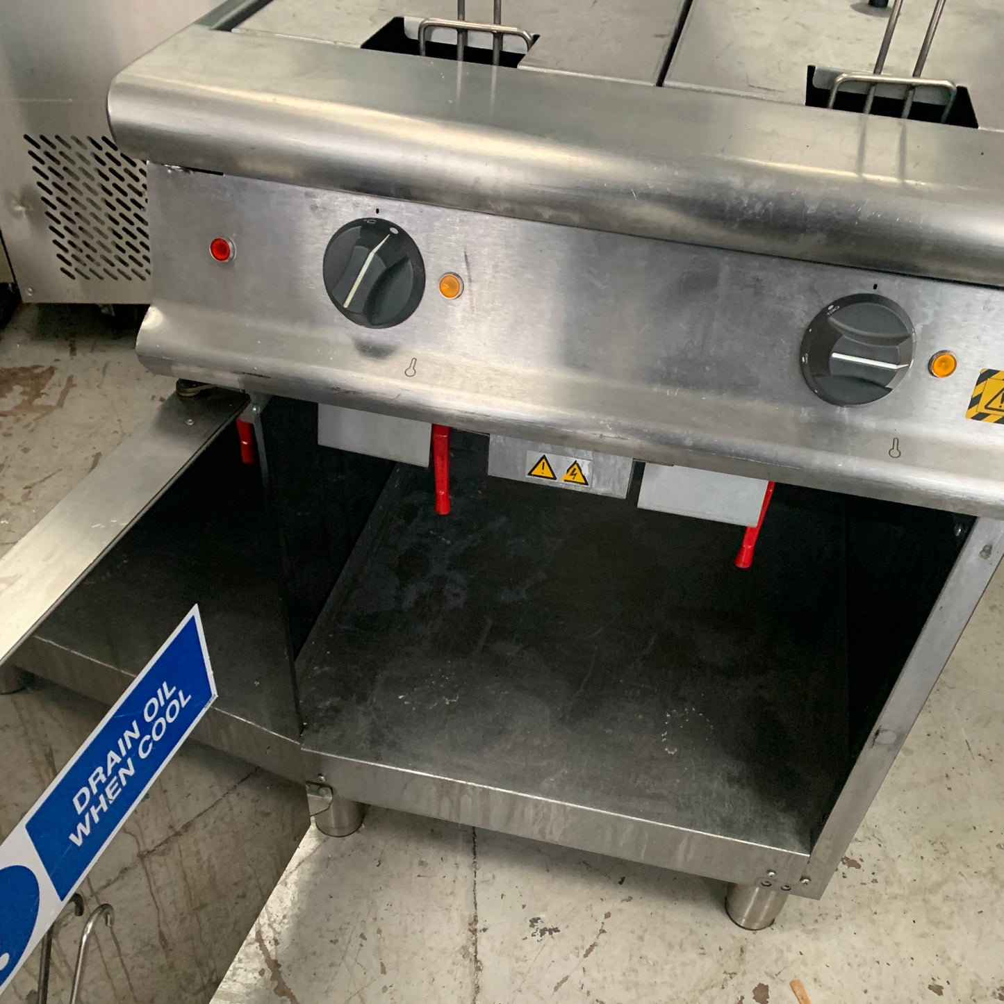 Second hand Falcon Twin Tank Electric Fryer under fryer cabinet with open door (E3862)