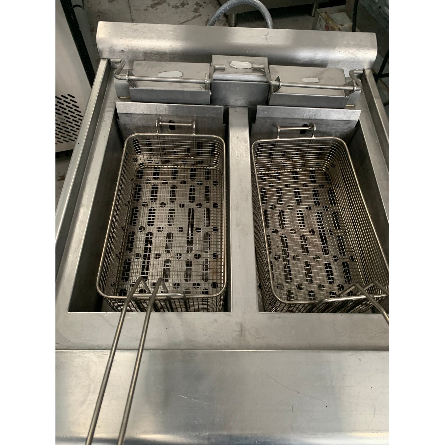 Second hand Falcon Twin Tank Electric Fryer (E3862) inside tank view with baskets